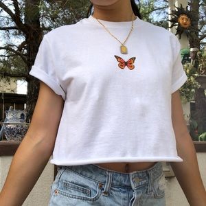 White crop top with orange or blue butterfly